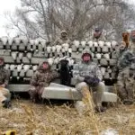 Group poses with harvested geese after a successful goose hunt.